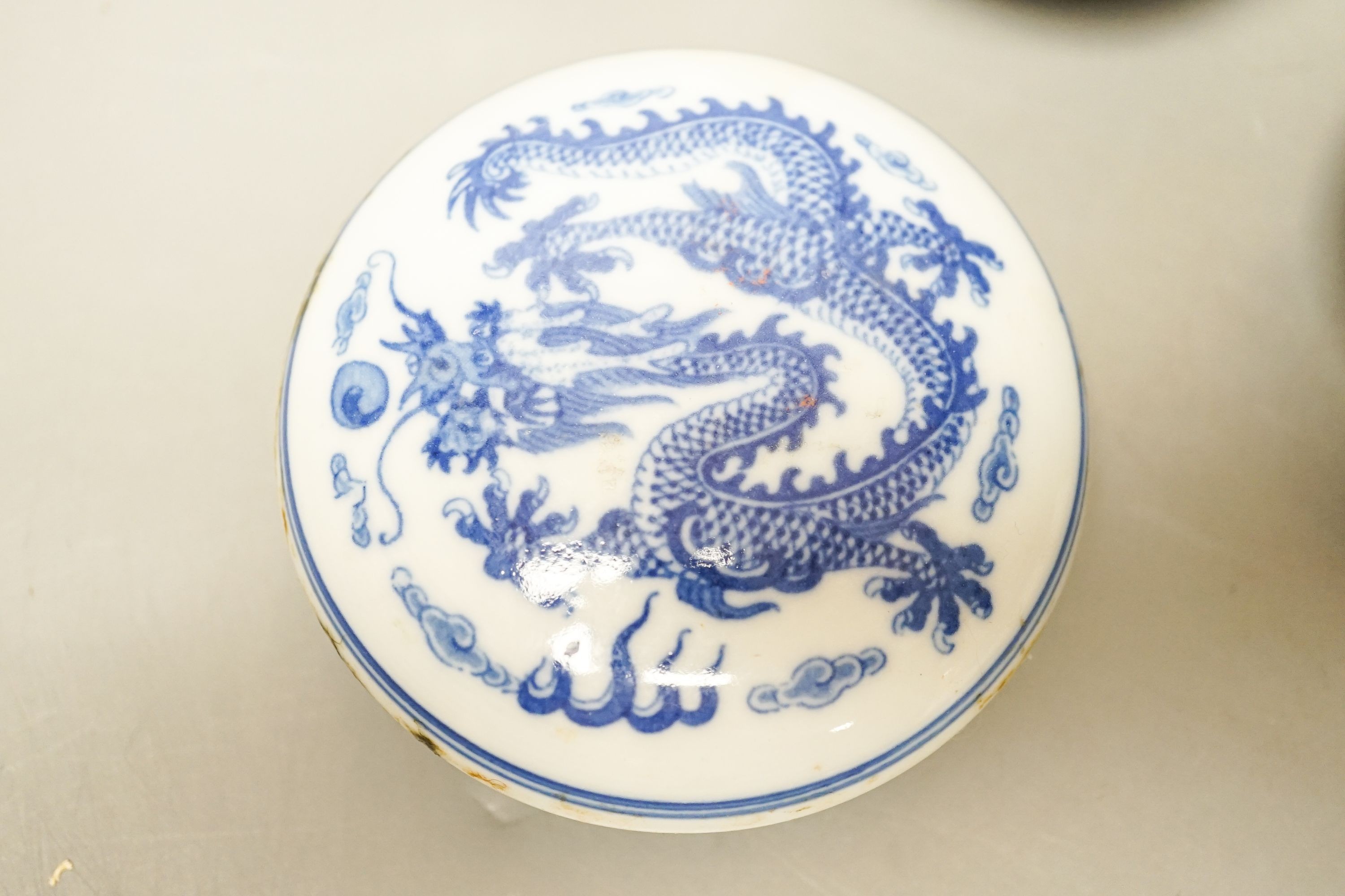 A Chinese underglaze blue and copper red snuff bottle, late 19th century, two blue and white bowls and a box and cover (4) 8.5cm